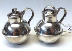 A pair of Silver-plated Condiments (Pepper and Mustard) in the form of Jersey Milk Cans, 2 ½” tall