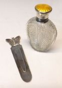 A George V Scent Flask, heavily cut with a diamond design, the screw-on lid with yellow enamelled