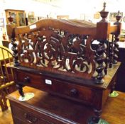 A Victorian Walnut Canterbury fitted with three sections and crested in the corners with ball