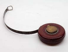 A Vintage Rabone & Sons leather cased Steel Tape Measure, with brass fittings, 4” diameter