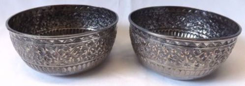 A pair of late 19th Century Indian White Metal circular Bowls with continuous embossed foliate