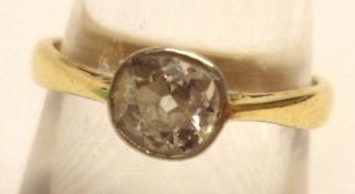 A high grade precious metal old cut Solitaire Diamond Ring, of approximately .5 ct, stamped “18ct”