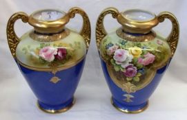 A pair of Noritake large two handled baluster Vases, painted in colours with extensive floral sprays