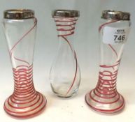 A pair of clear glass Specimen Vases with trailed red line overlay and Silver collars, 4” tall,