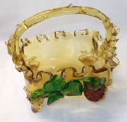 An Amber Glass small Basket with looped handle, crimped rim, applied with strawberry motif (handle