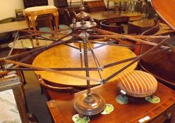 A Victorian Mahogany Pedestal String-Winder, of circular form and raised on balustered peg feet, 29”