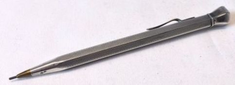 A mid 20th Century white metal encased Propelling Pencil, with engine turned panels, the clip