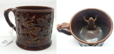 A Staffordshire Frog Mug, the outer body embossed with Bacchanalian figures and the inner with a