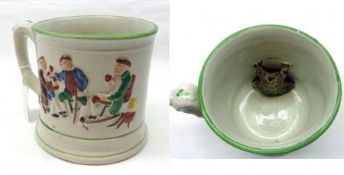 A Staffordshire Frog Mug of cylindrical form, embossed with figures in a tavern and with a black