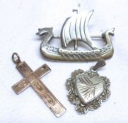 A Mixed Lot of mixed metal Cross; a white metal Viking Ship Brooch, stamped “stg.sil” and a