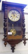 A small 1st quarter of the 20th Century Vienna style Wall Clock with stained wood case, plain gilded