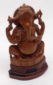 An Eastern carved Hardwood Model of a Deity, carved in the form of an Elephant, 6” high