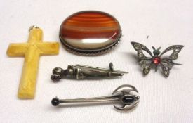 A packet containing four assorted white metal stone-set Brooches and a Cross (5)