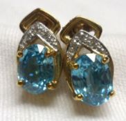 A pair of yellow metal Ratanakiri Zircon and small Diamond mounted Earrings