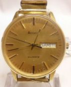 A last quarter of the 20th Century Gold Plated Quartz Centre Seconds Calendar Wristwatch,