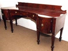 A late Regency period Mahogany Large Sideboard/Serving Table, the short pediment with ebonised