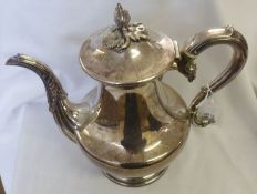 An early/mid 19th Century Sheffield plated Coffee Pot of circular baluster form, with leaf capped
