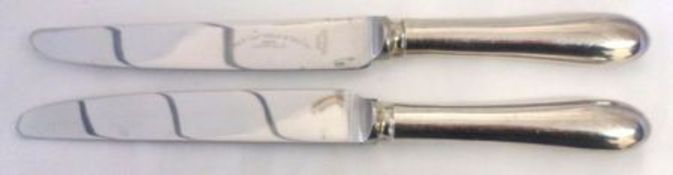 Eight each Stainless Steel bladed and Electroplate handled Dinner and Side Knives, retailed by