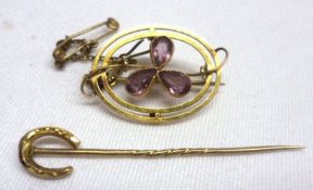 A box containing an Edwardian 9ct Gold oval openwork Brooch, the centre with a cloverleaf design set