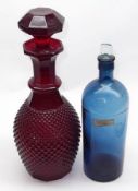 A red Glass Pineapple moulded covered Decanter and a further blue tinted Glass Drug Jar with a clear