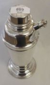 A mid 20th Century Electroplated Cocktail Shaker of tapering cylindrical form, to a circular foot,