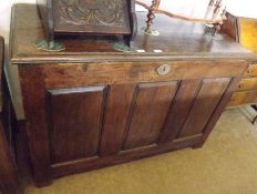 An Oak large Blanket Chest with moulded edge and three panelled front, raised on plain stile feet,