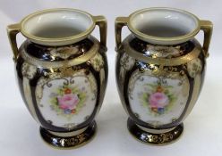 A pair of Noritake two handled baluster Vases of tapering form, decorated in colours with panels