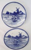 Two Royal Doulton “Norfolk” pattern blue printed Circular Plates (larger example with early