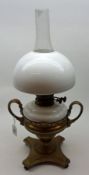 An Oil Lamp with opaque shade and font, brass support (possible composite), 21” high