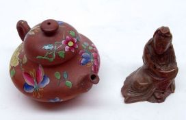 An Oriental Red Ware Teapot, painted in colours with floral sprigs and sprays; together with a small