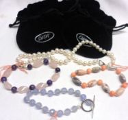 Five Bracelets with white metal clasps and gift bags, including Blue Chalcedony, Pink Coral,