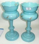 A pair of French pale blue Glass Lustres, each decorated in colours with floral sprigs together with