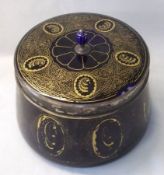 A Silver Plated Mounted Covered Glass Bowl, the border gilded with panels of scrolling foliage