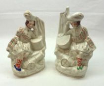 Two Staffordshire Figures of a sleeping drummer boy beside drum and a cannon, flesh colour and