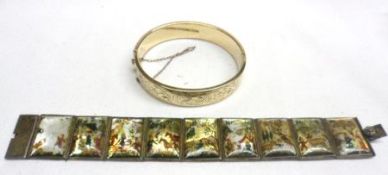 A packet containing an Engraved Gold Plated Bangle; together with an Indian metal framed Mother-of-