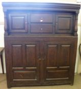 An 18th Century and later Oak Court Cupboard, the cupper section fitted with two central drawers,