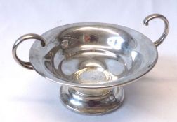 A hallmarked circular pedestal Bonbon Dish with two looped handles, (marks rubbed), 4” diameter,