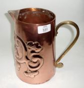 An Ornate Copper Jug with brass handle, the jug embossed with stylised twining scrolled foliage