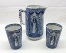 A European Ewer, printed in blue with an Oriental pattern together with two matching Beakers, (3)