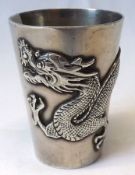 An early 20th Century Chinese white metal Thimble shaped measure with applied dragon decoration,