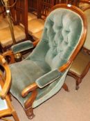 A Victorian Mahogany Spoon Back Armchair, upholstered in green button back with splayed scrolled