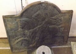 A Victorian Cast Iron Fire Back of arched form, the back embossed with a 17th Century mounted figure