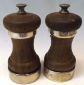 A pair of Elizabeth II Treen and Silver mounted Pepper Grinders of usual form, 4” tall, Birmingham