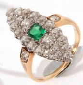 An unmarked precious metal Marquise design Ring, set to the centre with a square cut Emerald