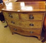 A Mahogany Small Bow Fronted Chest of two short and two full width drawers on splay feet, 19th