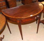 A late 18th/early 19th Century Mahogany Demi-Lune Fold Top Card Table, crossbanded boxwood and