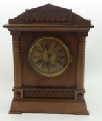 An early 20th Century German Stripped Wood Mantel Clock of architectural design, the composition