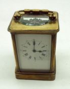 An early 20th Century French Lacquered Brass Carriage Clock, the silvered cylinder platform