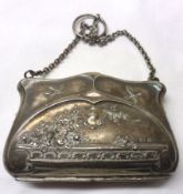 A George V Silver encased Evening Purse of shaped rectangular form, embossed with flowers, scrolls