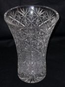 A heavy Lead Crystal large Trumpet Vase (chipped rim), heavily facetted with star cut base, 12” high